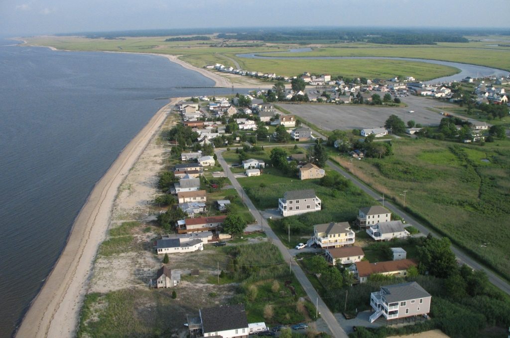 Aerial view of houses along a bay beach