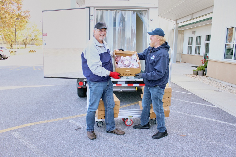 A worker processes venison