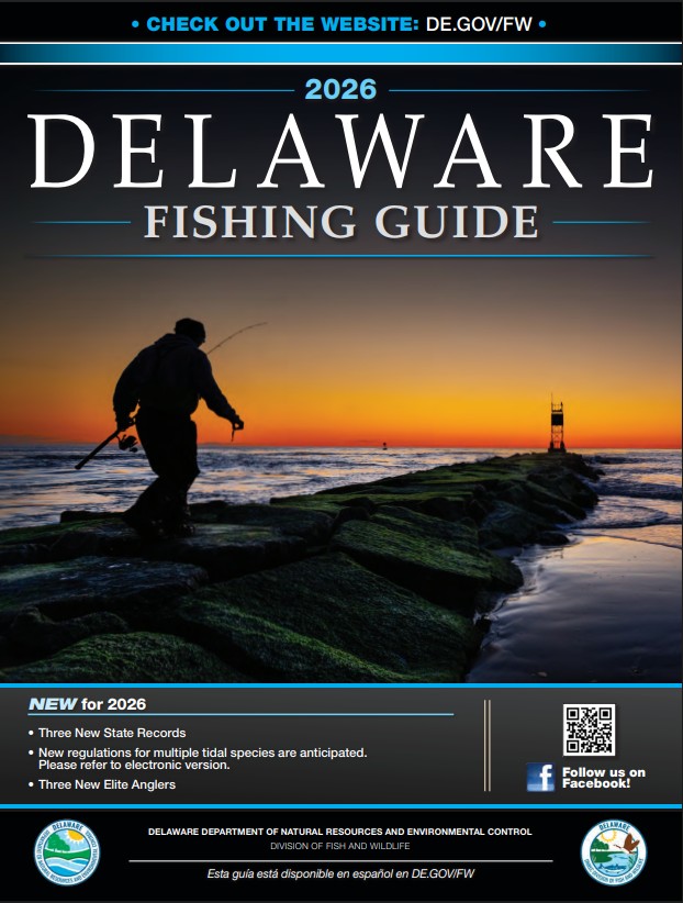 Cover of the 2026 Delaware Fishing Guide, featuring an image of an angler making their way out a stone jetty at dawn.