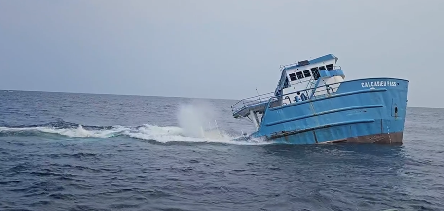 A large boat sinks.